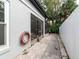Side yard with brick pavers and a hot tub at 749 Silver Birch Pl, Longwood, FL 32750