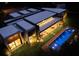 Night view of a modern home with pool and landscaping at 8968 Bay Cove Ct, Orlando, FL 32819