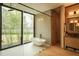 Modern bathroom with glass-enclosed shower and tranquil garden views at 8968 Bay Cove Ct, Orlando, FL 32819