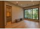 Bright bedroom featuring wood floors and large window at 8968 Bay Cove Ct, Orlando, FL 32819
