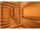 Large walk-in closet with ample shelving and lighting at 8968 Bay Cove Ct, Orlando, FL 32819