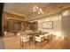 Elegant dining room featuring a long wooden table and modern chairs at 8968 Bay Cove Ct, Orlando, FL 32819