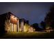 Night view of the home's exterior, showing modern design at 8968 Bay Cove Ct, Orlando, FL 32819