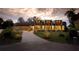 Modern home with a sleek design, landscaped yard, and a paved driveway at 8968 Bay Cove Ct, Orlando, FL 32819
