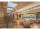 Sunlit living area with modern furniture and access to backyard at 8968 Bay Cove Ct, Orlando, FL 32819
