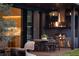 Modern outdoor kitchen with grill and dining area at 8968 Bay Cove Ct, Orlando, FL 32819