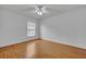 Bright bedroom with wood floors and window at 10828 Cherry Oak Cir, Orlando, FL 32817