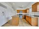 Bright kitchen with wood cabinets, granite counters, and stainless steel appliances at 10828 Cherry Oak Cir, Orlando, FL 32817