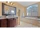 Double vanity bathroom with granite countertops and large mirror at 11359 Willow Gardens Dr, Windermere, FL 34786