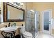 Elegant bathroom with a glass shower, pedestal sink, and granite vanity at 11359 Willow Gardens Dr, Windermere, FL 34786