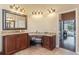 Bathroom with double vanity, granite countertop and view of bedroom at 11359 Willow Gardens Dr, Windermere, FL 34786