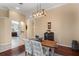 Rustic-chic dining room with wood table and view of kitchen at 11359 Willow Gardens Dr, Windermere, FL 34786