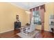 Bright dining area with hardwood floors and large window at 11359 Willow Gardens Dr, Windermere, FL 34786