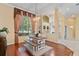 Elegant dining room with hardwood floors and farmhouse table at 11359 Willow Gardens Dr, Windermere, FL 34786