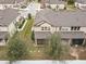 Aerial view of townhouses with backyard patios and surrounding landscape at 1164 Pavia Dr, Apopka, FL 32703