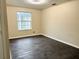 Spacious bedroom with dark floors and neutral walls at 118 Mandrake St, Orlando, FL 32811