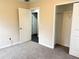 Bedroom with carpeted floors and a large closet at 118 Mandrake St, Orlando, FL 32811