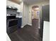 Modern kitchen with stainless steel appliances and dark floors at 118 Mandrake St, Orlando, FL 32811