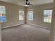 Spacious living room with neutral walls and carpeted floors at 118 Mandrake St, Orlando, FL 32811