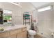 Clean bathroom with shower/tub combo and floral shower curtain at 120 Casterton Cir, Davenport, FL 33897