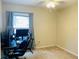 Bedroom with a desk and gaming chair, perfect for a home office at 120 Casterton Cir, Davenport, FL 33897