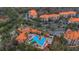 Aerial view of Tuscania condos, showing buildings, pool, and landscaping at 1361 Tuscan Ter # 7401, Davenport, FL 33896