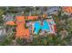 Aerial view of community pool, clubhouse, and surrounding landscape at 1361 Tuscan Ter # 7401, Davenport, FL 33896