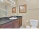 Bathroom with a shower, toilet and single vanity at 1361 Tuscan Ter # 7401, Davenport, FL 33896