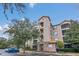 Tuscania condo building showcasing attractive exterior and landscaping at 1361 Tuscan Ter # 7401, Davenport, FL 33896