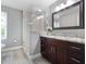 Large bathroom with double vanity and walk-in shower at 1375 Suffolk Rd, Winter Park, FL 32789