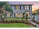 Two-story gray house with black shutters, landscaped yard, at dusk at 1375 Suffolk Rd, Winter Park, FL 32789