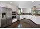 Modern kitchen with stainless steel appliances and white cabinets at 1375 Suffolk Rd, Winter Park, FL 32789