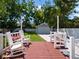 Relaxing patio area with rocking chairs, perfect for outdoor enjoyment at 1375 Suffolk Rd, Winter Park, FL 32789