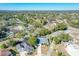 Aerial view of a residential neighborhood with houses and lush trees at 140 Rangeline Woods Cv, Longwood, FL 32750