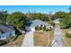 Aerial view of the house and surrounding neighborhood at 140 Rangeline Woods Cv, Longwood, FL 32750