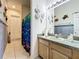 Bright bathroom with a shower/tub, vanity, and nautical decor at 140 Rangeline Woods Cv, Longwood, FL 32750