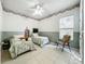 Spacious bedroom with two twin beds, a ceiling fan and window at 140 Rangeline Woods Cv, Longwood, FL 32750