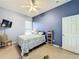 Bright bedroom with tiled floors and a ceiling fan at 140 Rangeline Woods Cv, Longwood, FL 32750