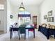 Bright dining room featuring a large window and wooden table with four chairs at 140 Rangeline Woods Cv, Longwood, FL 32750