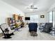 Relaxing living room with tiled floors, a ceiling fan, and plenty of natural light at 140 Rangeline Woods Cv, Longwood, FL 32750