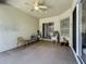 Covered patio with ceiling fan and seating area at 140 Rangeline Woods Cv, Longwood, FL 32750