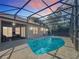 Inviting screened pool with a relaxing patio area at 140 Rangeline Woods Cv, Longwood, FL 32750