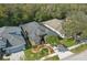 An aerial view of a charming single Gathering home, with mature trees and a well maintained yard at 1721 Lakelet Loop, Oviedo, FL 32765