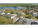 An aerial view shows the property's location within the community and near a lake and green spaces at 1721 Lakelet Loop, Oviedo, FL 32765