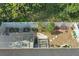 Overhead view of a well-maintained backyard, showcasing a screen enclosure, garden, and seating area at 1721 Lakelet Loop, Oviedo, FL 32765