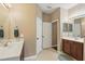 Bright bathroom with double sinks, white cabinets, and tile flooring at 1721 Lakelet Loop, Oviedo, FL 32765