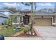 Charming single-story home with a well-manicured lawn, featuring a two-car garage and inviting front entrance at 1721 Lakelet Loop, Oviedo, FL 32765