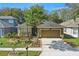 Inviting single-Gathering home with a manicured front yard and attached two-car garage at 1721 Lakelet Loop, Oviedo, FL 32765