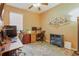 Well-lit home office with ceiling fan, modern desk, and a decorative accent rug at 1721 Lakelet Loop, Oviedo, FL 32765