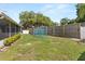 Expansive fenced backyard with mature landscaping and playground equipment providing outdoor enjoyment at 1792 Killarney Dr, Winter Park, FL 32789